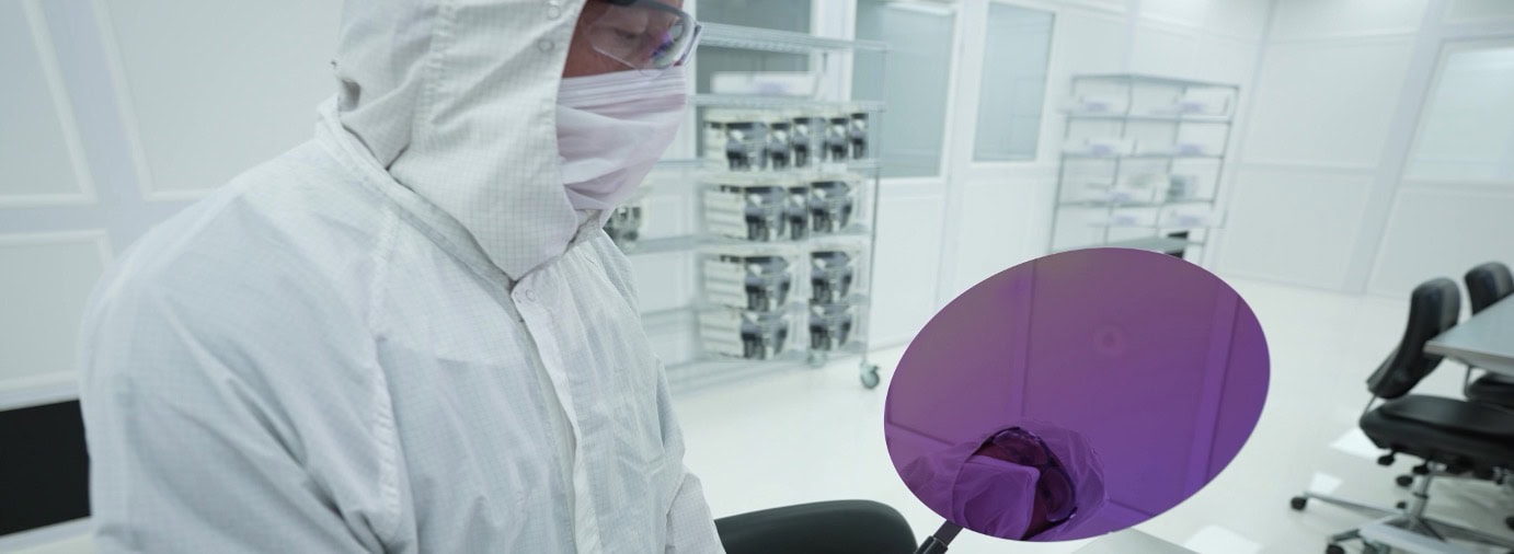 Rogue Valley Microdevices engineer loading film-coated wafers in the fab