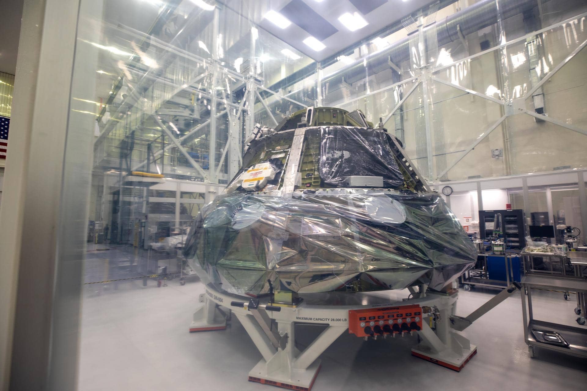 NASA's Artemis III Orion crew module under assembly in a cleanroom at Kennedy Space Center